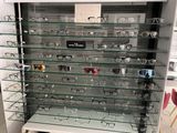 many glasses on the glass shelves in the store