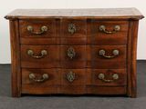 an image of a wooden chest of drawers with brass handles
