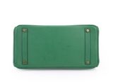 a green purse on a white background