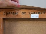 someone is holding a piece of wood with writing on it