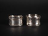 a pair of silver napkins on a black background