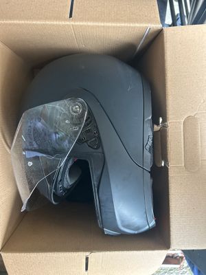 a cardboard box with a helmet inside of it