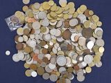 a pile of coins on a blue surface