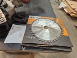 a picture of a table with a saw and a box of wood