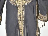 an image of a black and gold coat with a cross on it