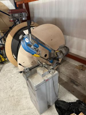 a machine that is sitting in a garage next to a box
