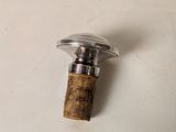 a wine bottle with a cork stopper attached to it