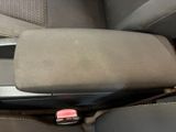a cup holder in the center of a car seat