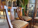 three chairs that are sitting in a room