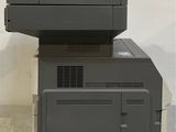 two printers sitting on top of each other on the floor