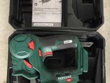 a green and black tool in a black case
