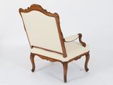 an image of a chair with a white upholstered back and arms