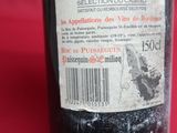 a bottle of wine that is sitting on a table