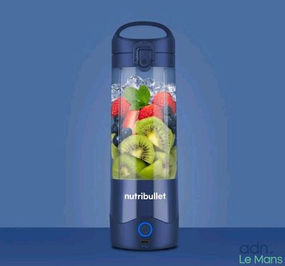 a blender that has a lot of fruit in it