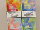 three boxes of cigarettes sitting on top of a table next to each other