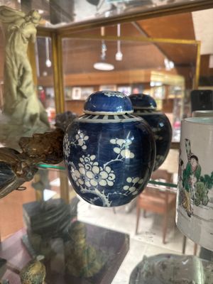 many vases on display in a glass case