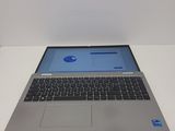 an open laptop computer sitting on top of a white table