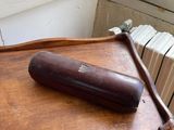 a wooden table with a baseball bat on top of it