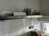 a kitchen with a lot of dishes on the counter