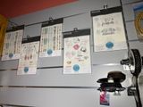 many papers hanging on the wall of a room