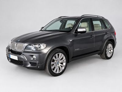 the bmw x5 is parked in a studio with a white background