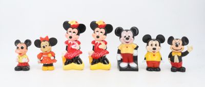mickey and minnie mouse figurines are lined up in a row