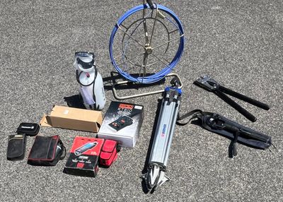 a lot of items that are laying out on the ground
