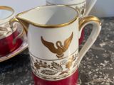 two cups and saucers are sitting on a table