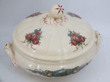 an image of a tureeny dish with flowers on it