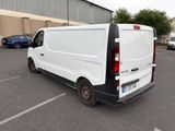 a white van that is parked in a parking lot