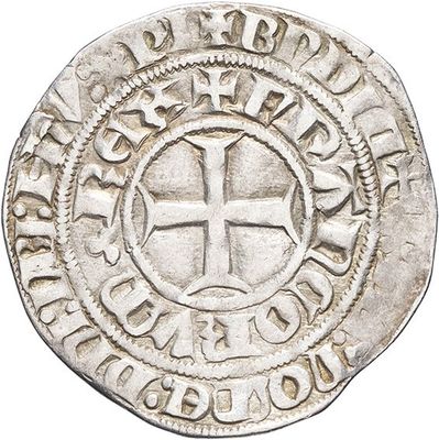 an old silver coin with a cross on it