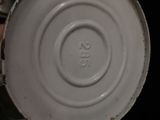 a close up of a white vase with a number on it