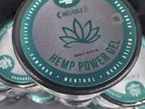 several tins of hemp power gel sitting on top of each other