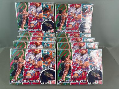 six packs of anime trading cards are stacked on top of each other