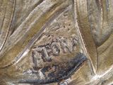 a close up of a bronze statue of a woman
