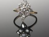 an image of a diamond ring on a reflective surface