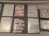 a lot of different stamps on a table together