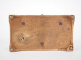 an old wooden box with four screws on the top