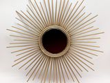 gold sunburst wall mirror with black glass