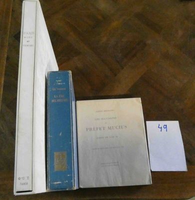 several books are sitting on a table next to each other