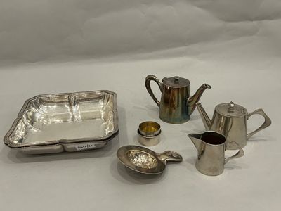 a lot of silver items that are on a table