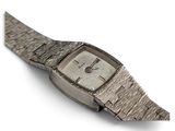 wrist watch on a white surface with a white background
