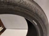 a close up of a tire on a wooden stand