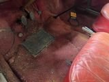 a red leather seat in the back of a car