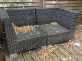 a couch that is sitting on a wooden deck
