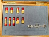 a wooden box with a set of tools in it