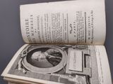 an open book with a picture of a man on it