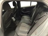 the back seats of a silver car with a black seat belt