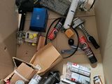 a cardboard box filled with assorted items on the floor