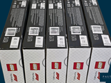 six boxes of pizza sitting on top of each other